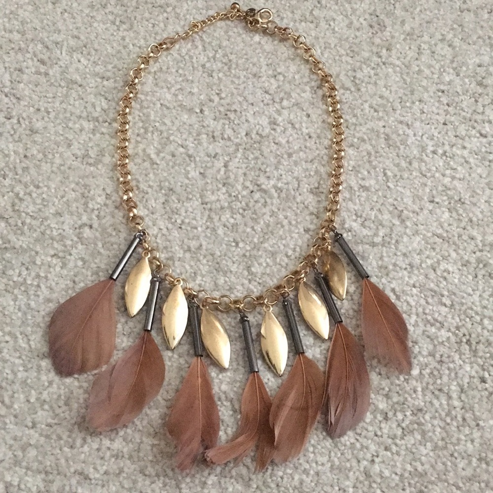 Gold chain statement necklace with feathers.
